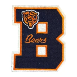 Chicago Bears classic B logo embroidered patch featuring navy and orange letter design with bear head emblem.